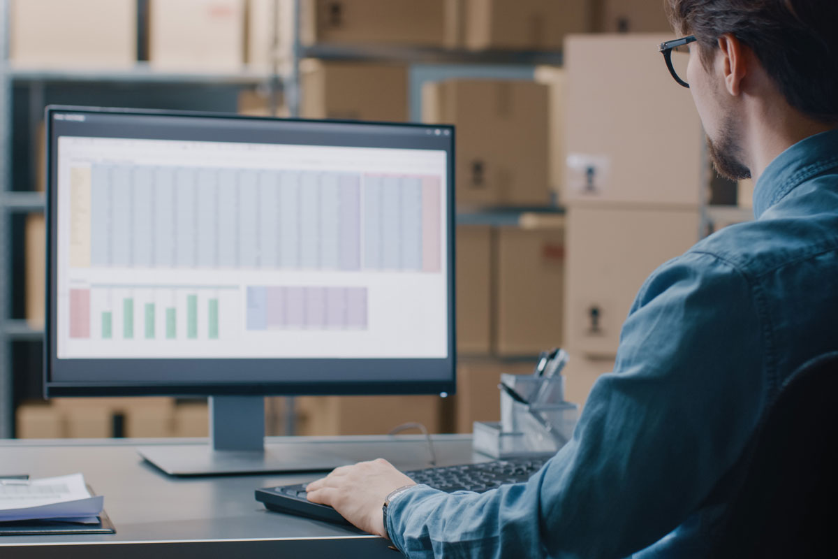 employee looking at mailing list on computer