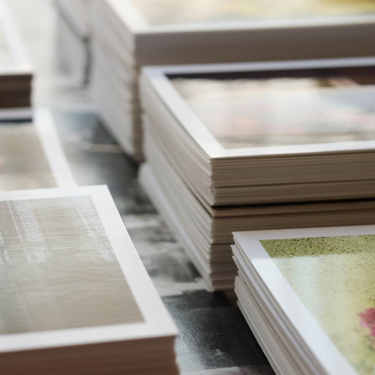 postcards stacked on a table